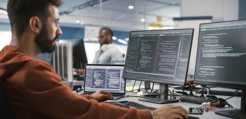 software developer using a monitor